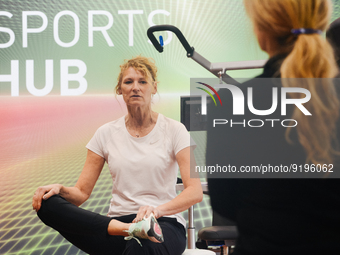 Heike Henkel, an Olympic champion, teaches exercise during the opening day of Medica 2022, a medical technology and health care exhibition i...