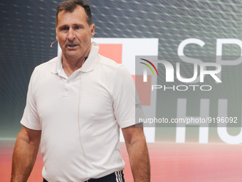 Lars Riedel, an Olympic champion, teaches exercise during the opening day of Medica 2022, a medical technology and health care exhibition in...