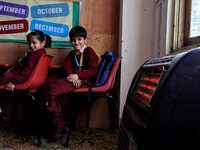 Students read inside a class room as heating facilities are installed at Ahmed public school in Baramulla Jammu and Kashmir India on 18 Nove...