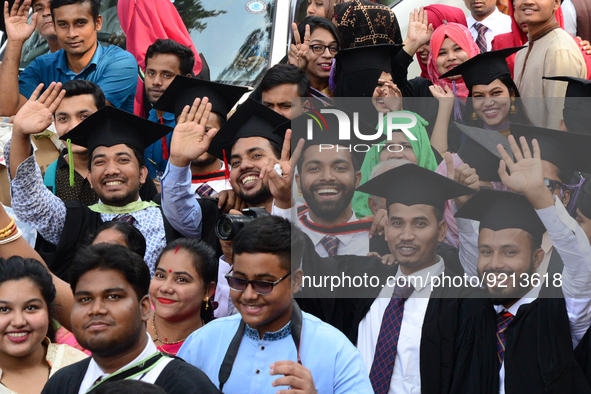 A group of graduates gather to expressing their delight of the Curzon hall at university area, on the 53th convocation of the students of Dh...