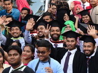 A group of graduates gather to expressing their delight of the Curzon hall at university area, on the 53th convocation of the students of Dh...