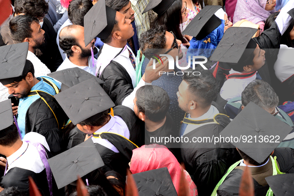 A group of graduates gather to expressing their delight of the Curzon hall at university area, on the 53th convocation of the students of Dh...