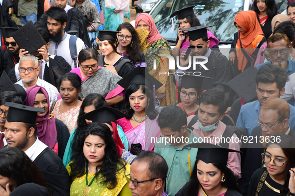 A group of graduates gather to expressing their delight of the Curzon hall at university area, on the 53th convocation of the students of Dh...