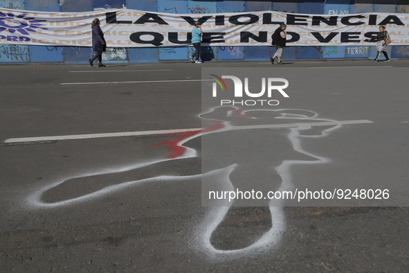 A silhouette painted on the ground in Mexico City's Zócalo to mark the International Day for the Elimination of Violence against Women. This...