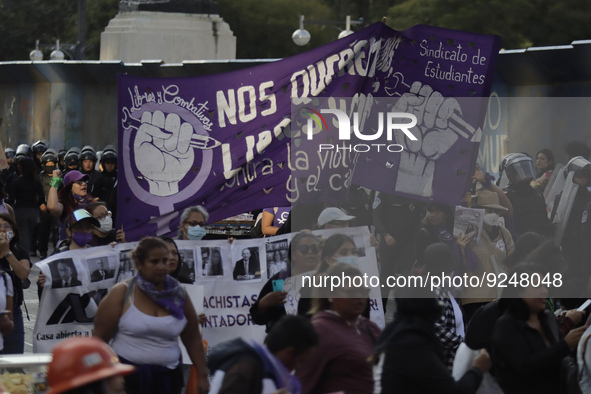 Mothers of victims of feminicide, relatives of disappeared persons and various feminist collectives march with banners and posters from the...