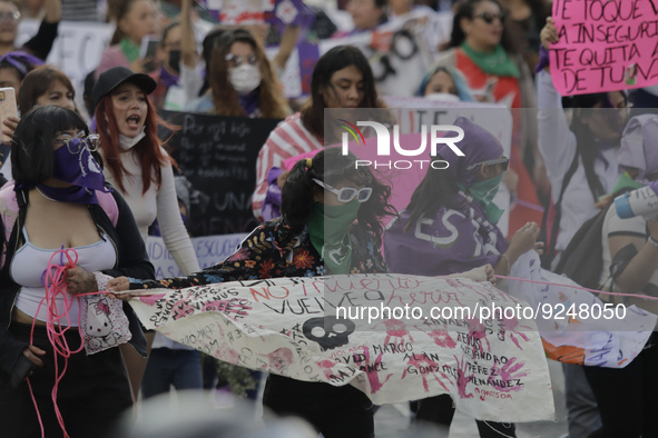 Mothers of victims of feminicide, relatives of disappeared persons and various feminist collectives march with banners and posters from the...