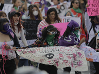 Mothers of victims of feminicide, relatives of disappeared persons and various feminist collectives march with banners and posters from the...
