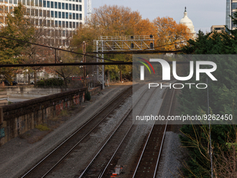 The U.S. Capitol is seen beyond railway tracks in Washington, D.C. on November 29, 2022 as Congress prepares to act to avoid a potential nat...