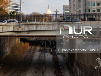 The U.S. Capitol is seen beyond railway tracks in Washington, D.C. on November 29, 2022 as Congress prepares to act to avoid a potential nat...