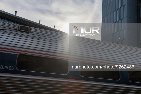 Sunlight shines over a commuter train at the Virginia Railway Express L'Enfant Station in Washington, D.C. on November 29, 2022 as Congress...