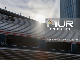 Sunlight shines over a commuter train at the Virginia Railway Express L'Enfant Station in Washington, D.C. on November 29, 2022 as Congress...