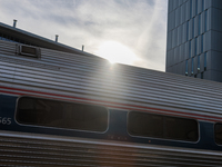 Sunlight shines over a commuter train at the Virginia Railway Express L'Enfant Station in Washington, D.C. on November 29, 2022 as Congress...