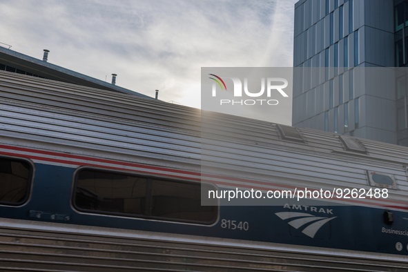 Sunlight shines over a commuter train at the Virginia Railway Express L'Enfant Station in Washington, D.C. on November 29, 2022 as Congress...