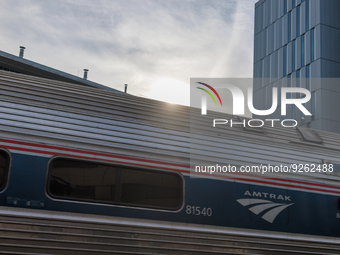 Sunlight shines over a commuter train at the Virginia Railway Express L'Enfant Station in Washington, D.C. on November 29, 2022 as Congress...