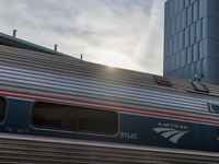 Sunlight shines over a commuter train at the Virginia Railway Express L'Enfant Station in Washington, D.C. on November 29, 2022 as Congress...