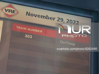 Commuter train statuses are listed on an electronic sign at the Virginia Railway Express L'Enfant Station in Washington, D.C. on November 29...