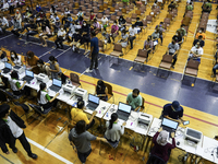 Thai people to  register to get vaccinated a COVID-19 booster at a vaccination center inside a stadium in Bangkok, Thailand, 03 December 202...