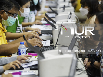 Thai people to  register to get vaccinated a COVID-19 booster at a vaccination center inside a stadium in Bangkok, Thailand, 03 December 202...