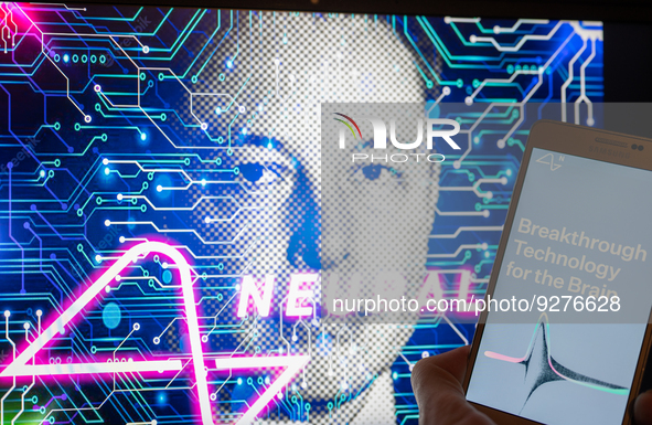 Neuralink logo displayed on mobil with founder Elon Musk seen on screen in the background. Neuralink Corporation is a neurotechnology compan...