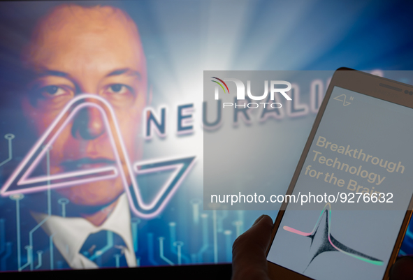 Neuralink logo displayed on mobil with founder Elon Musk seen on screen in the background. Neuralink Corporation is a neurotechnology compan...