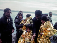 Migrants approach the coast of the northeastern Greek island of Lesbos on Thursday, Nov. 26, 2015. About 5,000 migrants are reaching Europe...