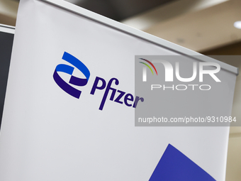 Pfizer logo is seen during the job fair, organized mainly for Ukrainian refugees, in Krakow, Poland on December 8, 2022. (