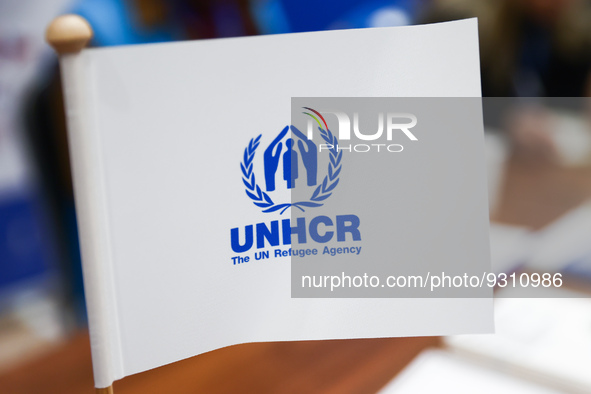 UNHCR logo is seen on a flag during the job fair, organized mainly for Ukrainian refugees, in Krakow, Poland on December 8, 2022. 