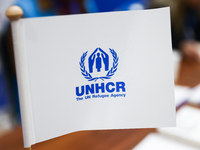 UNHCR logo is seen on a flag during the job fair, organized mainly for Ukrainian refugees, in Krakow, Poland on December 8, 2022. (