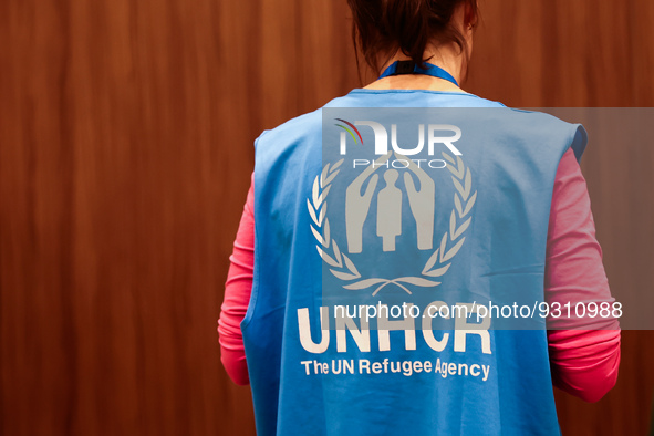 UNHCR logo is seen on a person's vest during the job fair, organized mainly for Ukrainian refugees, in Krakow, Poland on December 8, 2022. 