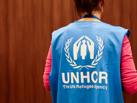 UNHCR logo is seen on a person's vest during the job fair, organized mainly for Ukrainian refugees, in Krakow, Poland on December 8, 2022. (