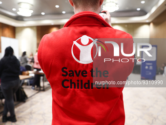 Save the Children logo is seen on a person's fleece during the job fair, organized mainly for Ukrainian refugees, in Krakow, Poland on Decem...