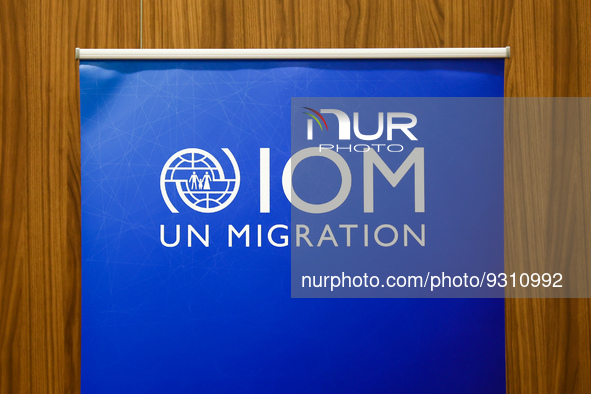 International Organization for Migration logo is seen during the job fair, organized mainly for Ukrainian refugees, in Krakow, Poland on Dec...