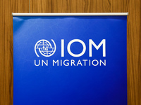 International Organization for Migration logo is seen during the job fair, organized mainly for Ukrainian refugees, in Krakow, Poland on Dec...