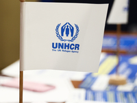 UNHCR logo is seen on a flag during the job fair, organized mainly for Ukrainian refugees, in Krakow, Poland on December 8, 2022. (