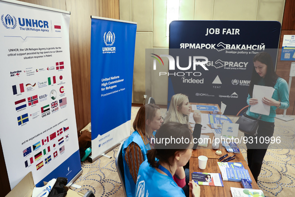 People are seen during the job fair, organized mainly for Ukrainian refugees, in Krakow, Poland on December 8, 2022. 