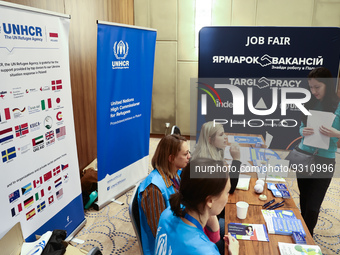 People are seen during the job fair, organized mainly for Ukrainian refugees, in Krakow, Poland on December 8, 2022. (