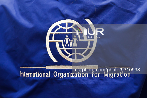 International Organization for Migration logo is seen during the job fair, organized mainly for Ukrainian refugees, in Krakow, Poland on Dec...