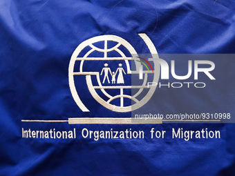 International Organization for Migration logo is seen during the job fair, organized mainly for Ukrainian refugees, in Krakow, Poland on Dec...