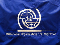 International Organization for Migration logo is seen during the job fair, organized mainly for Ukrainian refugees, in Krakow, Poland on Dec...