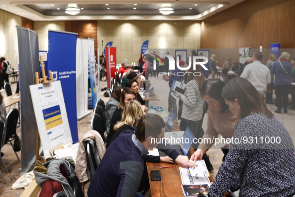 People are seen during the job fair, organized mainly for Ukrainian refugees, in Krakow, Poland on December 8, 2022. 