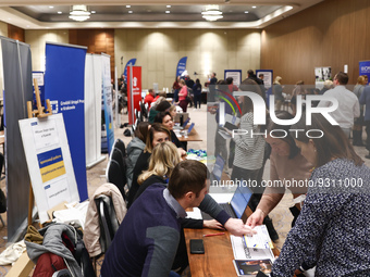 People are seen during the job fair, organized mainly for Ukrainian refugees, in Krakow, Poland on December 8, 2022. (