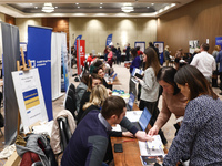 People are seen during the job fair, organized mainly for Ukrainian refugees, in Krakow, Poland on December 8, 2022. (