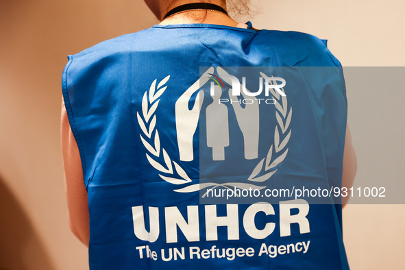 UNHCR logo is seen on a person's vest during the job fair, organized mainly for Ukrainian refugees, in Krakow, Poland on December 8, 2022. 