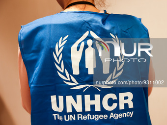 UNHCR logo is seen on a person's vest during the job fair, organized mainly for Ukrainian refugees, in Krakow, Poland on December 8, 2022. (