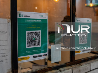 Leave Home Safe QR code placed on the window of a restaurant on December 13, 2022 in Hong Kong, China. The Hong Kong Government announced th...