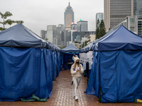 A women leaving a Covid-19 community testing centre on December 14, 2022 in Hong Kong, China. The Hong Kong Government announced yesterday a...