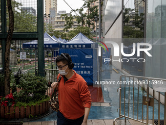 A man leaving a Covid-19 community testing centre on December 14, 2022 in Hong Kong, China. The Hong Kong Government announced yesterday at...