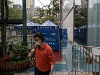 A man leaving a Covid-19 community testing centre on December 14, 2022 in Hong Kong, China. The Hong Kong Government announced yesterday at...