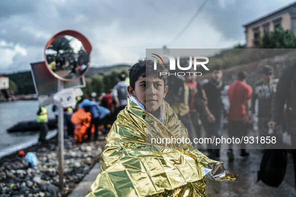  Migrants approach the coast of the northeastern Greek island of Lesbos on Thursday, Nov. 28, 2015. About 5,000 migrants are reaching Europe...