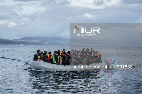  Migrants approach the coast of the northeastern Greek island of Lesbos on Thursday, Nov. 28, 2015. About 5,000 migrants are reaching Europe...